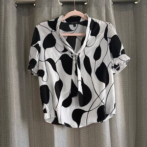 Elegant Black and White Blouse with Tie Neck